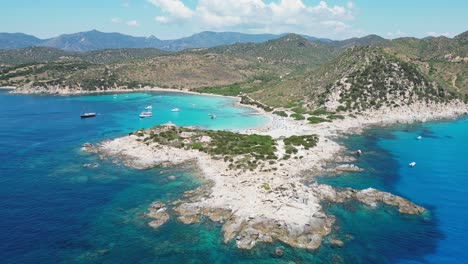 Punta-Molentis-Beach-in-Villasimius,-Sardinia---Peninsula-and-Turquoise-Blue-Bay---Aerial-4k-Pedestal-Up