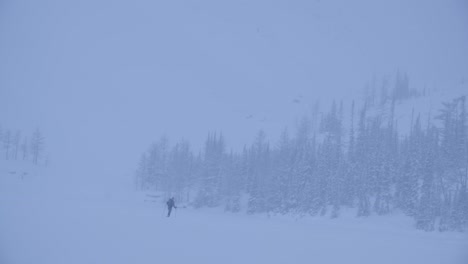 Backcountry-Skier-in-Banff-National-Park,-Lake-Agnes,-Snowstorm,-4K