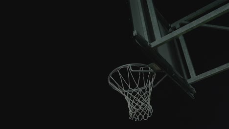 Basketball-ball-clean-hit-basket-in-slow-motion,-low-angle-view-of-scoring-or-pointing
