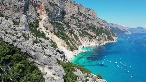 Baunei-Coast-and-Cala-Goloritze-Beach-Rock-Formations-in-Sardinia,-Italy---Aerial-4k