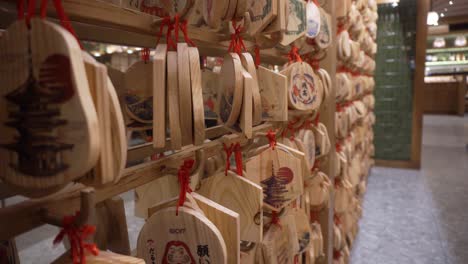 Still-shot-of-wooden-ornamental-tags-in-a-Japanese-restaurant