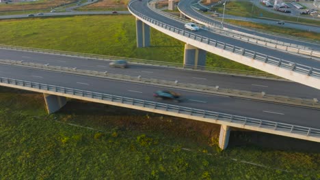 A-country-highway-with-a-bridge-and-overpasses-on-which-cars-and-trucks-travel
