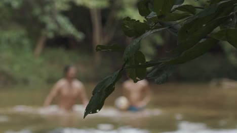 People-swimming-in-a-river-in-Brazil---artistic-focus-on-the-foreground