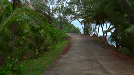 Mahe-Seychelles,-Coastal-road-driving-on-isolated-road,-a-small-road-reaching-the-far-south-of-the-island