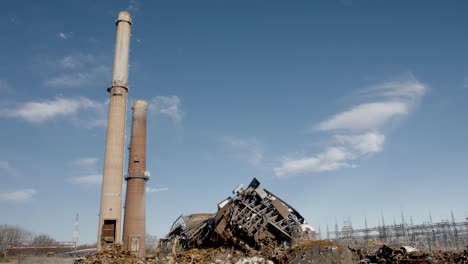 old-smoke-stacks-next-to-demolished-coal-fired-power-plant-ruins