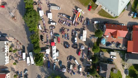Small-Lithuanian-town-of-Sveksna-street-market,-aerial-top-down-view