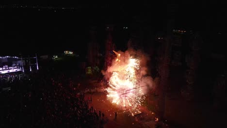 Aerial-view-of-people-gathered-in-the-park,-enjoying-and-watching-an-amazing-fireworks-show