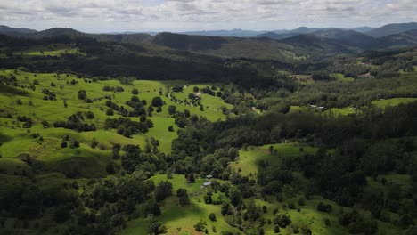 Australian-hinterland-scene-with-sweeping-valley-pastures-and-stunning-distant-mountain-views