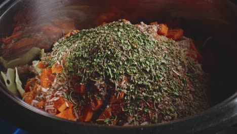 Dried-Parsley-And-Oregano-Dropped-Over-Heap-Of-Herbs-In-Vegetable-Pot-Stew