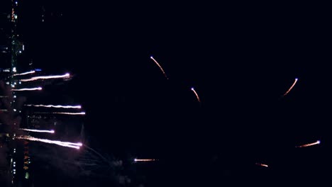 Abstract-colored-real-firework-background-with-big-shining-glowing-fireworks-show-with-bokeh-lights-in-the-night-sky