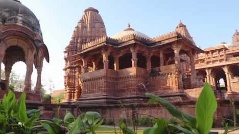 ancient-hindu-temple-architecture-with-bright-blue-sky-from-unique-angle-at-day-shot-taken-at-mandore-garden-jodhpur-rajasthan-india
