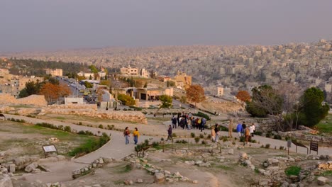 People-exploring-Amman-Citadel-archeological-historical-site,-Jabal-al-Qalaa,-tourism-landmark-in-capital-city-of-Jordan