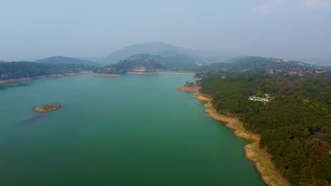 pristine-lake-at-the-edge-of-mountain-forests-aerial-shots-at-morning-video-is-taken-at-umiyam-lake-shillong-meghalaya-india