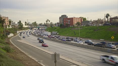 Los-Angeles-Traffic-moving-both-ways,-mid-day-in-Hollywood