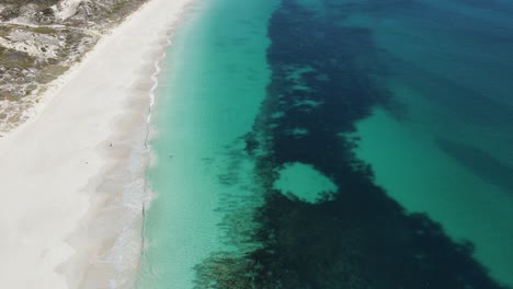 Aerial-footage-of-Mindarie-Beach-showing-off-the-clear-ocean-water-and-white-sands-of-Perth-Western-Australia