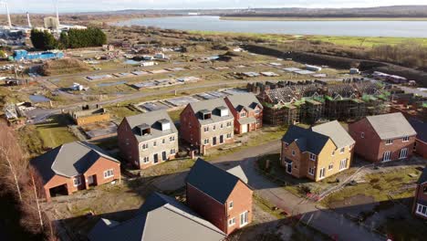 Abandoned-waterfront-townhouse-property-development-construction-site-aerial-view
