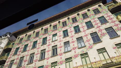 View-of-painted-buildings-as-seen-from-a-bus-window-in-Vienna,-Austria