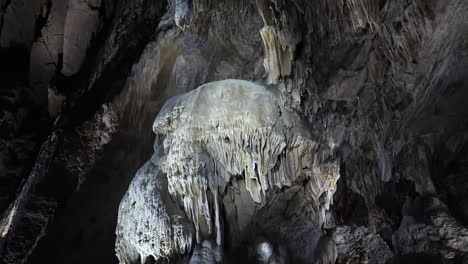 Slow-tilt,-draperies-and-stalactites-in-Belgian-caves,-Grottes-de-Han