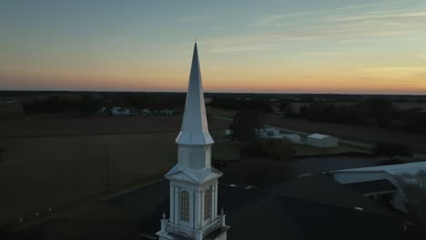 Church-steeple-view-of-a-sunset-near-Silverhill,-Alabama