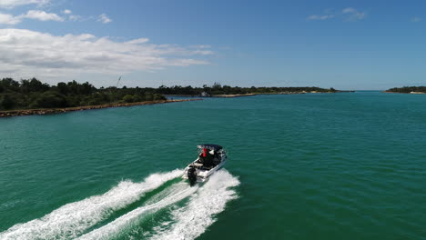 following-boat-blue-waters-Lakes-Entrance