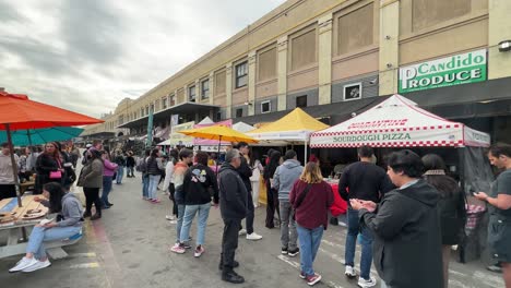 Walking-along-the-open-air-food-vendors-at-Smorgasburg-in-Los-Angeles,-California