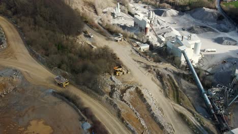 From-Rock-to-Lime:-A-Look-at-the-Processes-and-Equipment-in-a-German-Limestone-Quarry,-a-massive-rock-truck-driving-on-a-mining-road-towards-the-plant