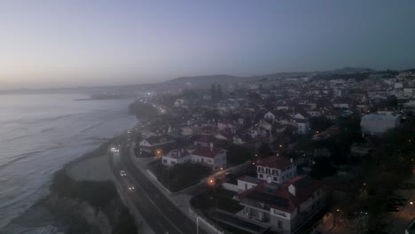Aerial-drone-view-over-the-cityscape-of-Cascais-in-Lisbon,-Portugal-at-dusk-time