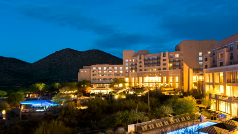 Time-lapse-of-a-cool-blue-sunrise-over-a-hotel-establishment-in-Tucson,-Arizona
