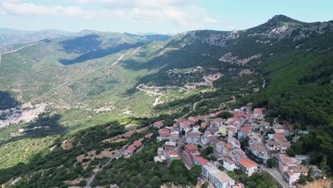 Baunei-and-Urzulei-Village-in-Green-Mountains-of-Sardinia,-Italy---Aerial-4k