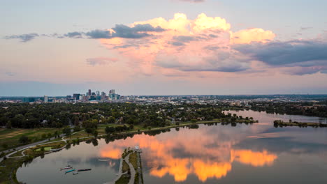 Aerial-hyperlapse-of-Denver's-Sloan-Lake-with-Denver's-downtown-skyscrapers-off-in-the-distance