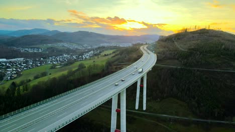 Golden-Hour-Cars-and-Trucks-Crossing-North-Rhine-Westphalia's-Tallest-Autobahn-Bridge,-Talbrücke-Nuttlar