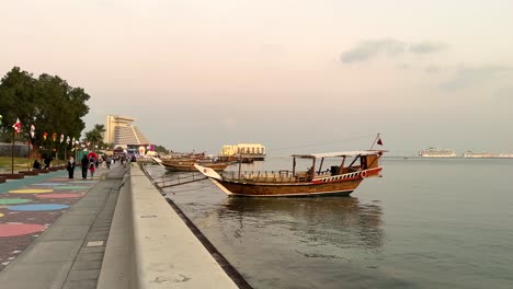 Traditional-Local-people-skill-made-Dhow-sailing-boat-wooden-material-ancient-design-sea-transport-marina-tourist-vehicle-at-the-corniche-beach-in-Doha-Qatar-used-for-fishing-and-tour-Arabian-culture