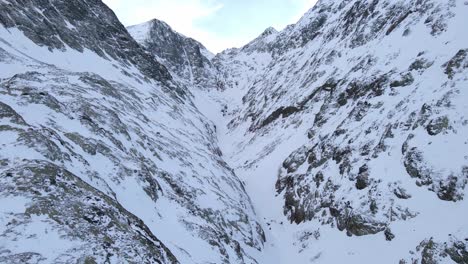 Drone-footage-of-a-snowy-valley-in-the-pyrenees-mountains