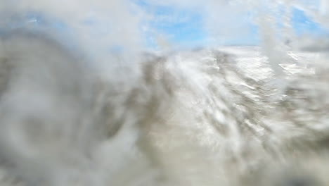 Large-Wave-Crashes-on-Coastline-of-Green-Sand-Beach-on-Camera