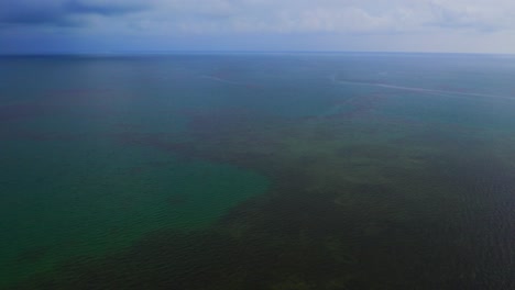 Drone-shot-above-the-lagoon,-capturing-the-blue-waters-from-a-bird's-eye-view