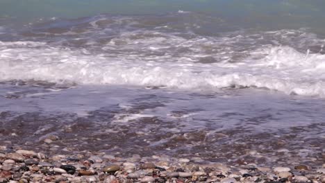 Waves-Breaking-On-Pebble-Beach-In-Rhodes