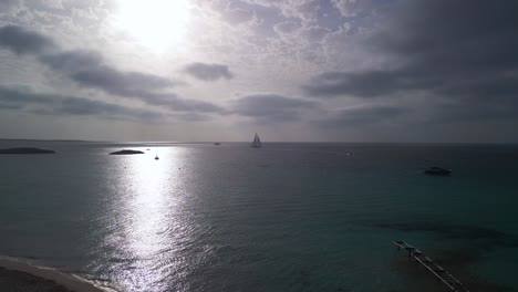 Round-sun,-sailboat-on-horizon