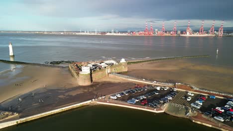 Fort-Perch-Rock,-New-Brighton,-River-Mersey,-Wirral---aerial-drone-clockwise-pan,-Liverpool-waterfront-reveal-on-a-sunny-winter-afternoon-08