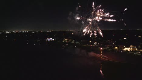 Aerial-view-of-fireworks-above-the-lake
