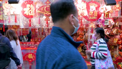 People-buy-Chinese-New-Year-decorative-ornaments-and-gifts-at-a-street-market-stall-during-the-preparation-for-the-Chinese-New-Year-celebration-and-festivities