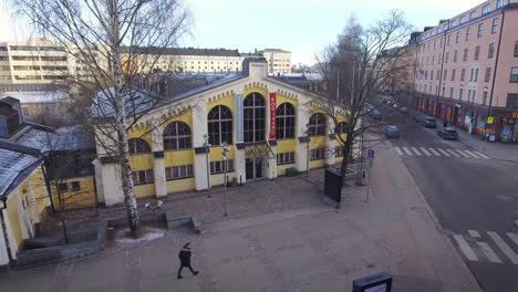 Aerial-footage-of-Kulttuuritehdas-Korjaamo-event-venue-and-Ratikkamuseo-on-a-sunny-winter-day