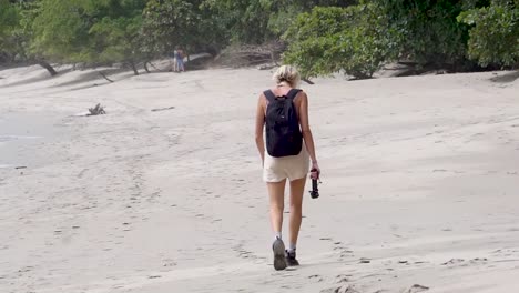Blonde-girl-walks-on-the-beach-of-Manuel-Antonio-in-Costa-Rica