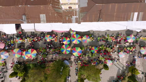 Top-down-aerial-footage-of-a-busy-market-street-in-San-Juan-Ostuncaclo,-Guatemala