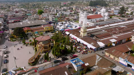 Aerial-footage-during-the-daytime-rotating-around-the-main-square-of-San-Juan-Ostuncaclo