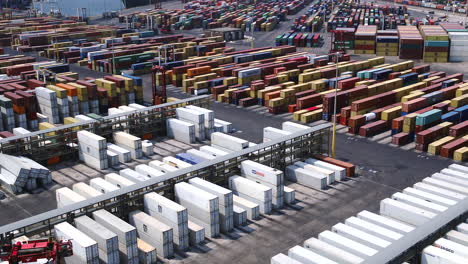 Aerial-drone-rising-shot-over-a-shipping-container-yard-in-Durban-harbour