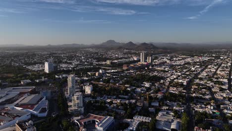 Aerial-view-of-the-Culiacán-Rosales-city,-sunny-day-in-northwestern-Mexico---tracking,-drone-shot
