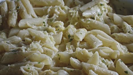 Pasta,-cheese-and-herbs-are-baked-together-to-create-a-creamy,-melty-appetizing-dish
