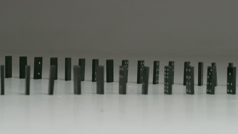 rows-of-black-dominoes-in-studio
