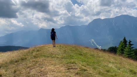 A-girl-hiking-in-the-Carpathian-mountains-of-Romania-near-Busteni-city
