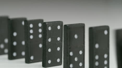 row-of-black-dominoes-with-white-dots